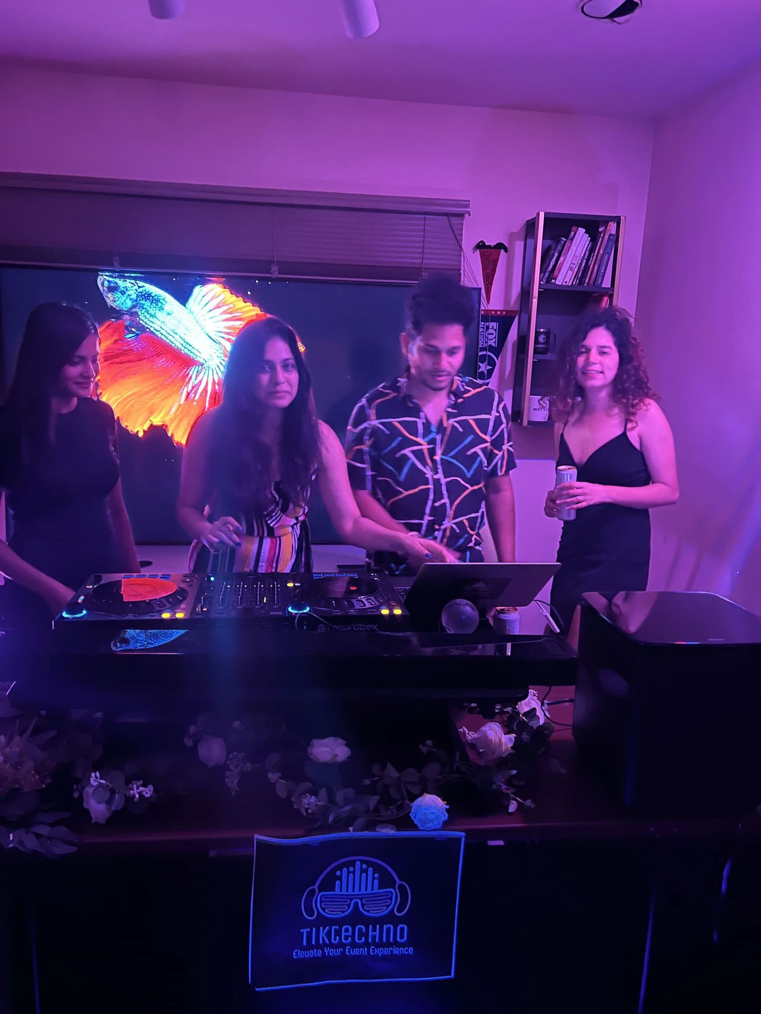 DJ playing to a full floor of dancing guests