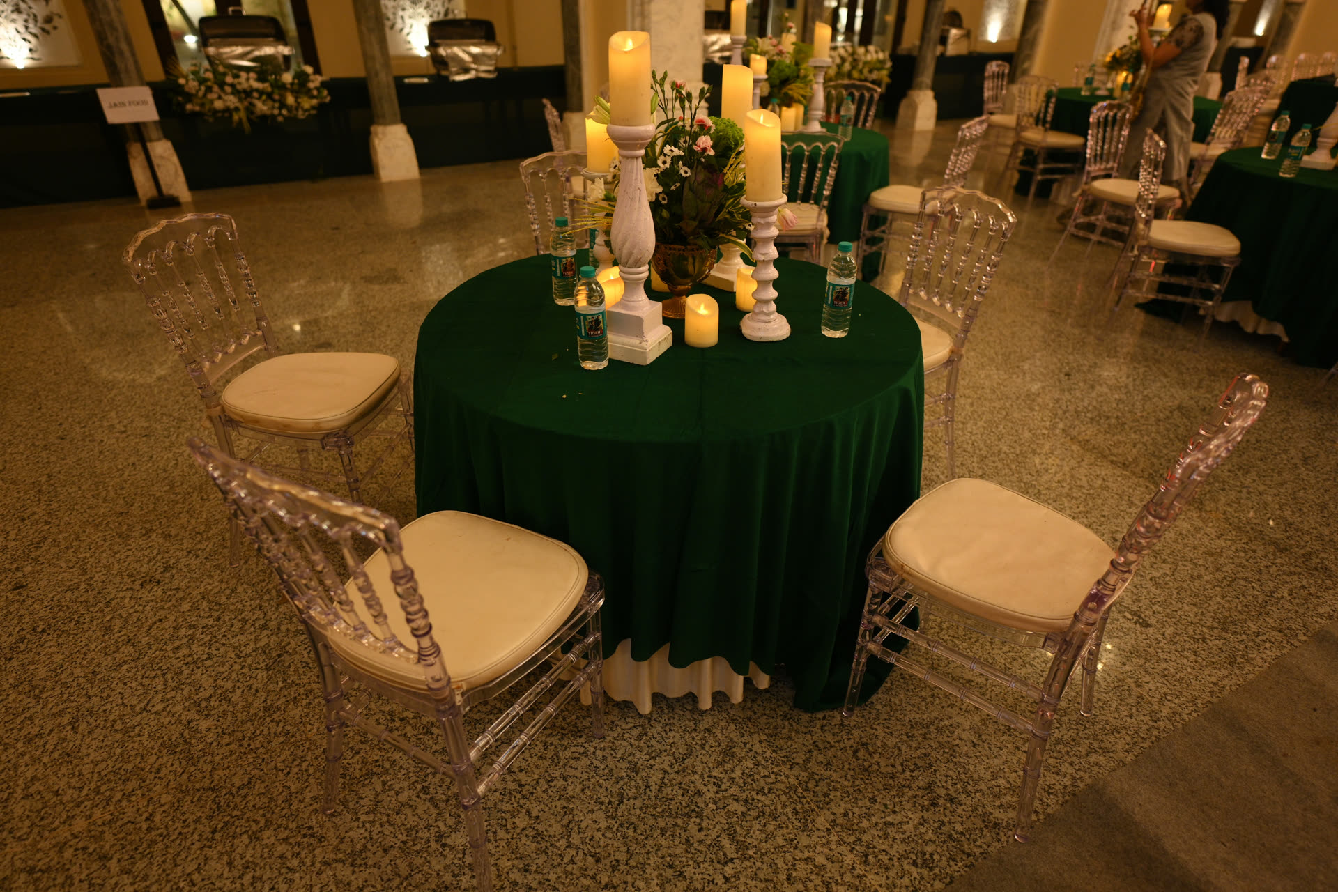 Gala round tables with candles and greenery