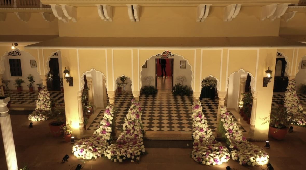Wedding stage styled with blush and cream florals