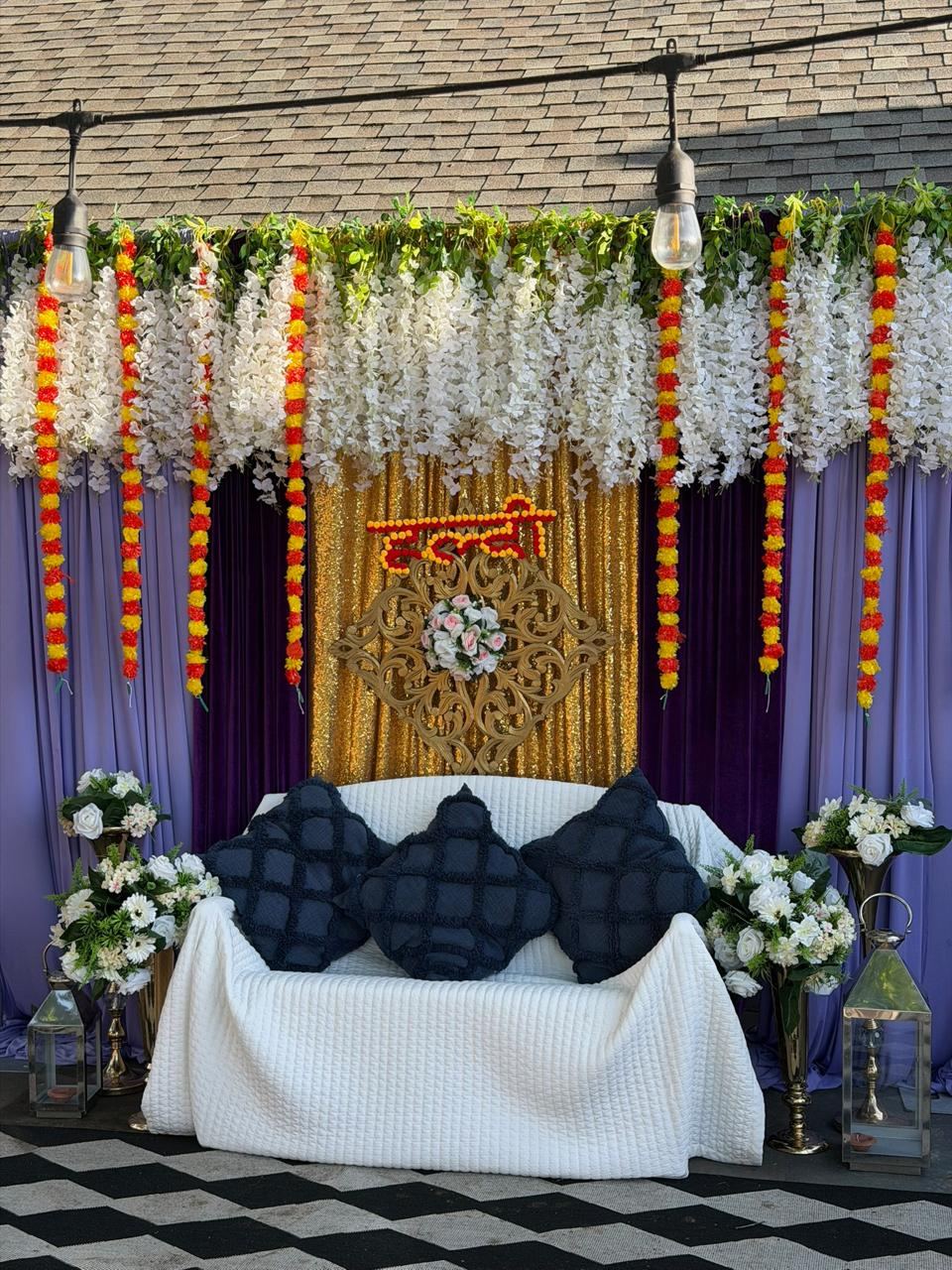 Wedding mandap dressed with florals and drapes